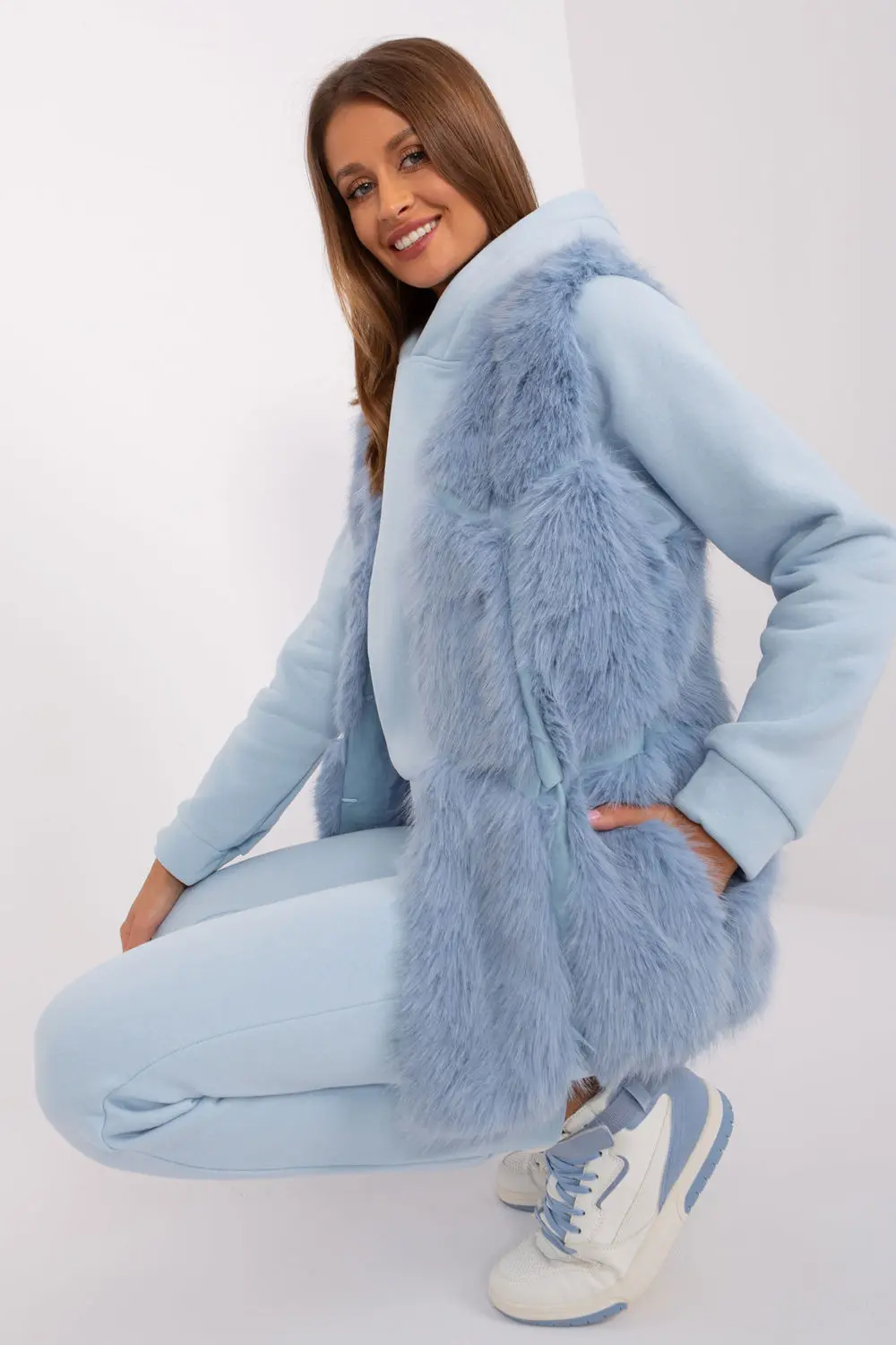Gilet en fausse fourrure bleu à capuche