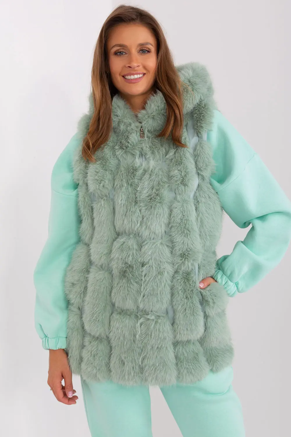 Gilet en fausse fourrure vert à capuche