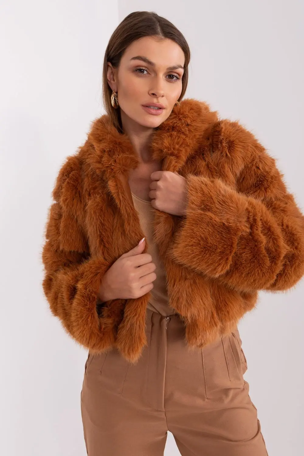 Veste en fausse fourrure brune à capuche