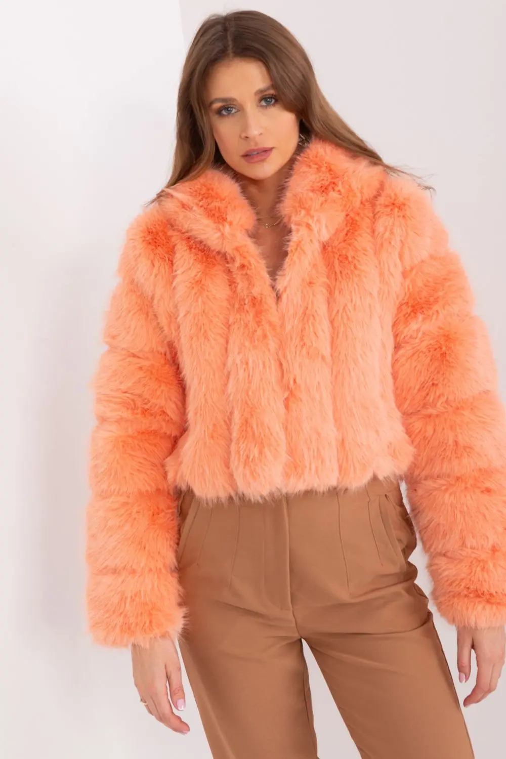 Veste en fausse fourrure orange à capuche