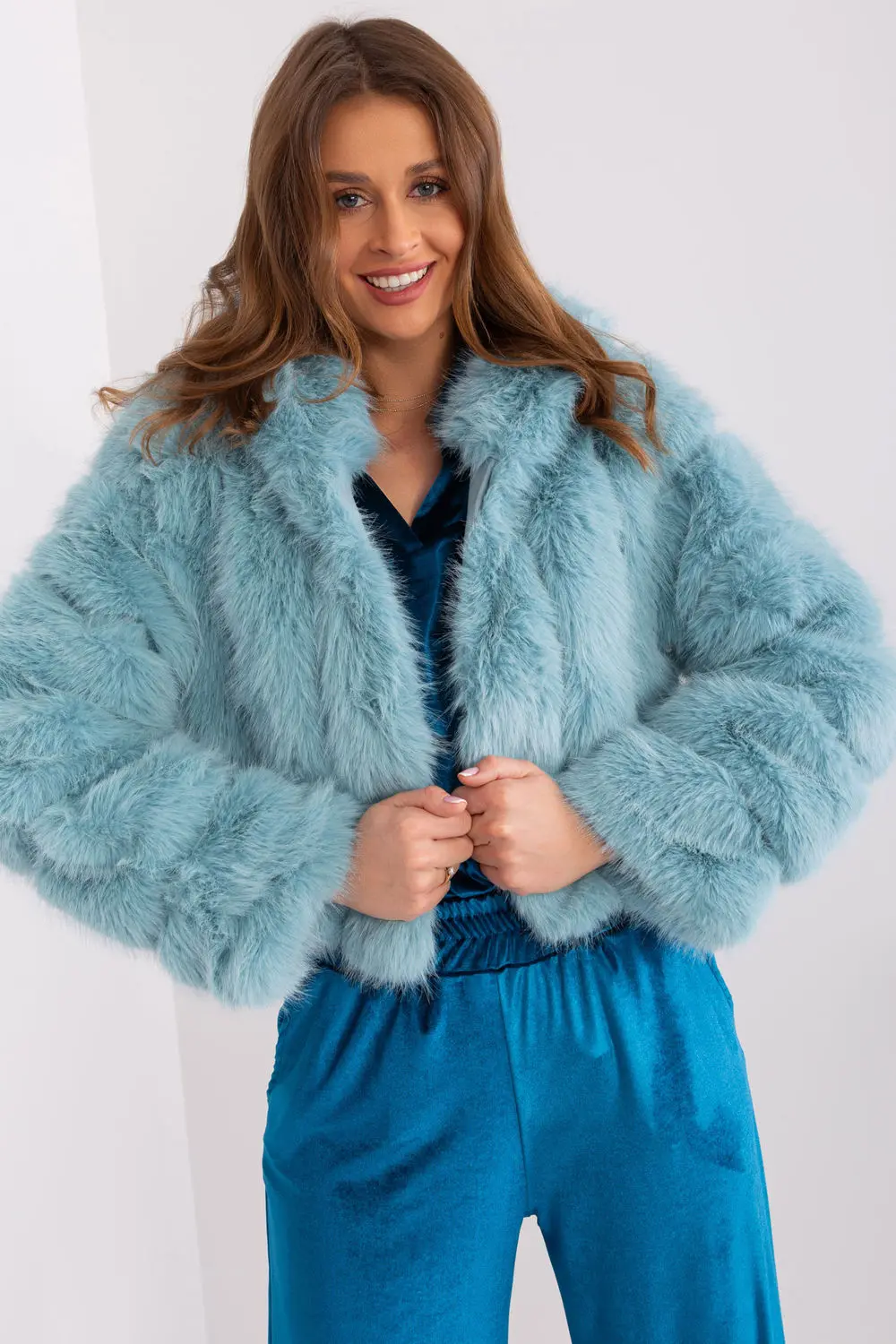 Veste en fausse fourrure verte à capuche