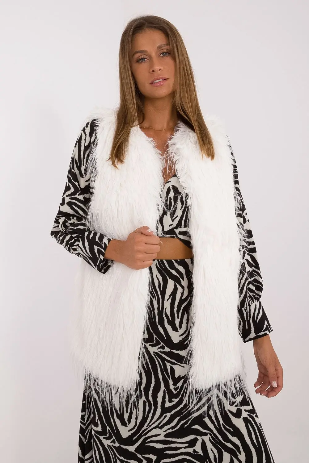 Gilet en fausse fourrure beige à capuche