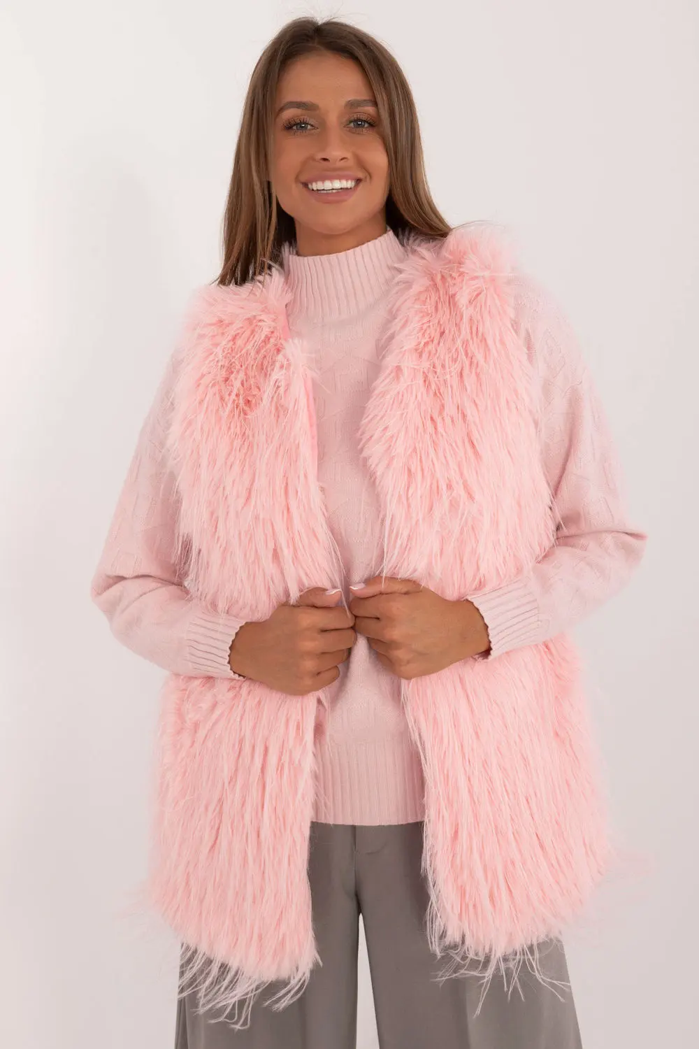 Gilet en fausse fourrure rose à capuche
